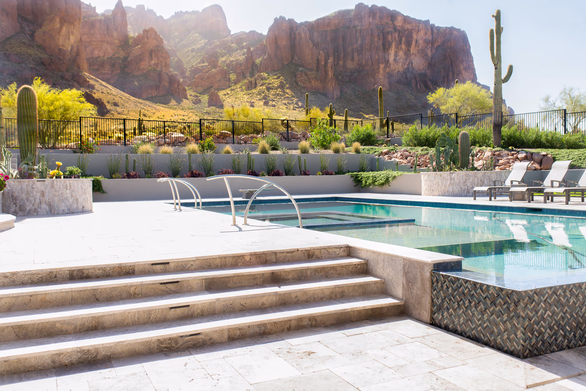 Family gathered on a covered patio at dusk, an example of evening backyard design in Arizona