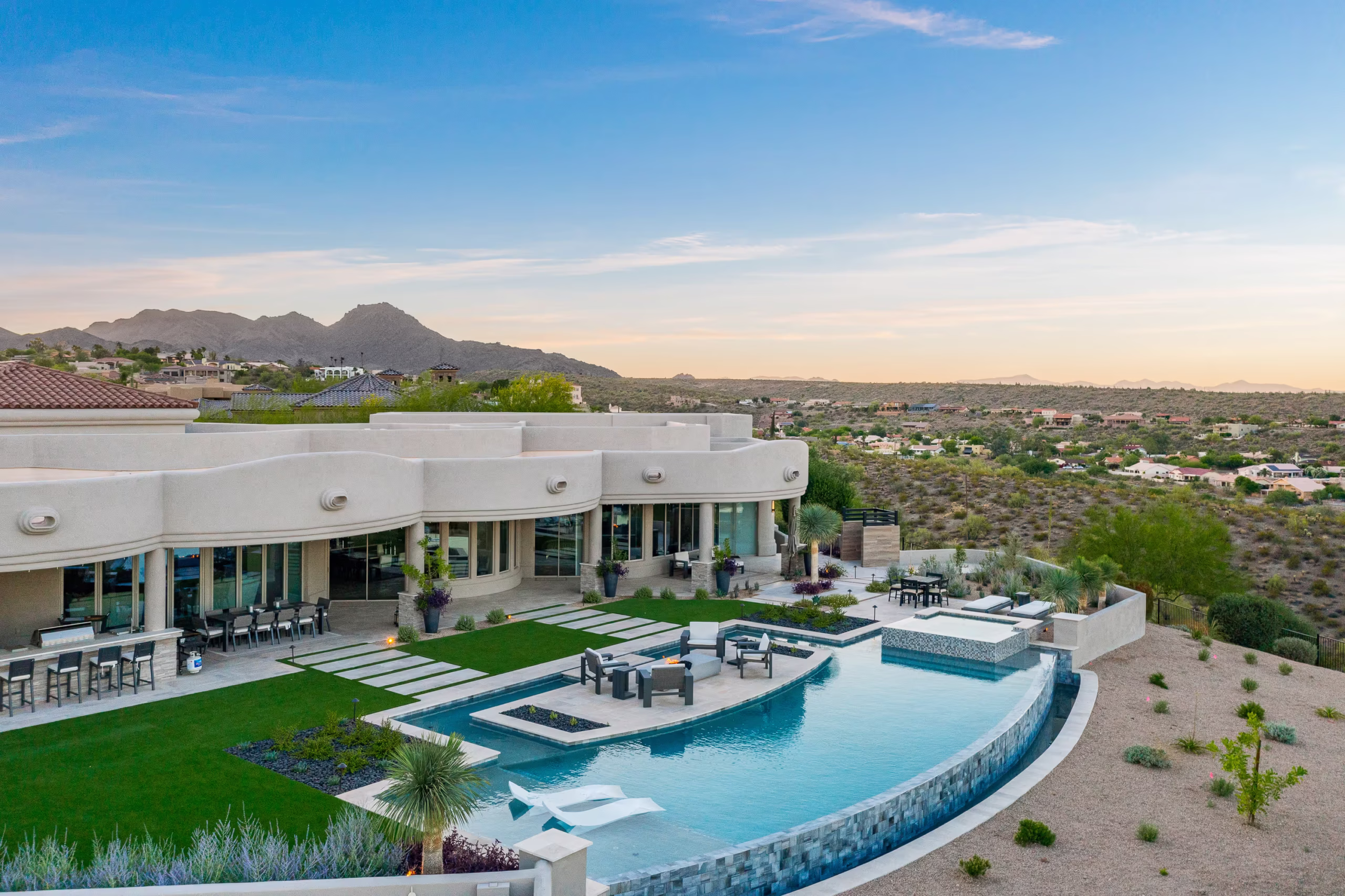 Luxury spec home outdoor living space in Paradise Valley with pool and desert landscaping